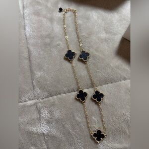 Elegant Gold and Black Clover Necklace